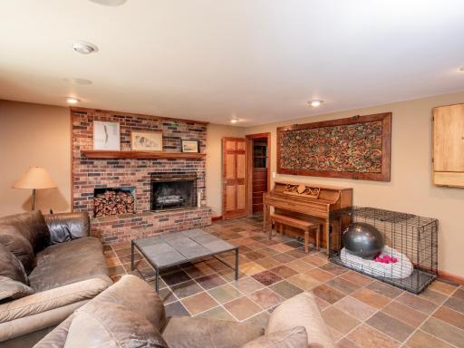 Enter the home on the Lower Level and enjoy the spacious family room, bar, recreation area and fireplace.