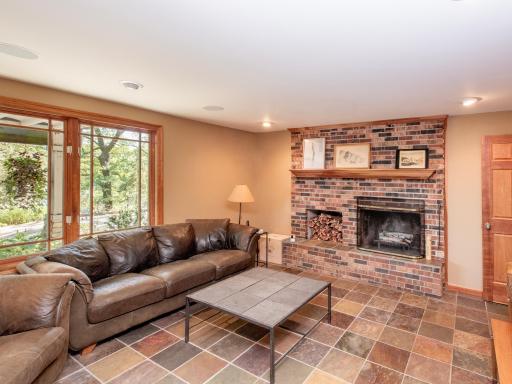 Enter the home on the Lower Level and enjoy the spacious family room, bar, recreation area and fireplace.