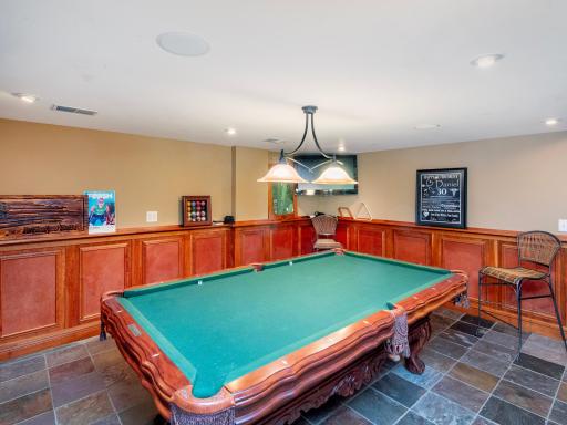 Enter the home on the Lower Level and enjoy the spacious family room, bar, recreation area and fireplace.