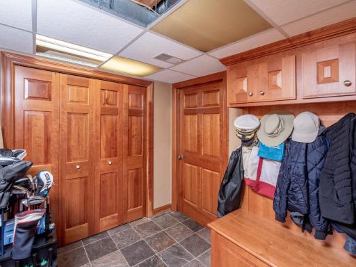 Mud Room Lower Level with entrance into Mechanical Room.