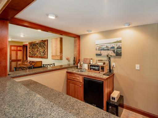 Enter the home on the Lower Level and enjoy the spacious family room, bar, recreation area and fireplace.