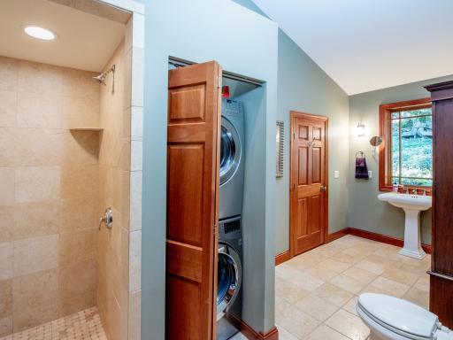 Main Floor 3/4 Bath with convenient stacked Washer-Dryer.