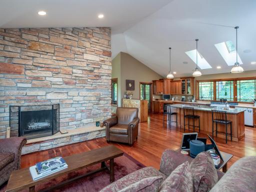 Stone fireplace with casual sitting area.