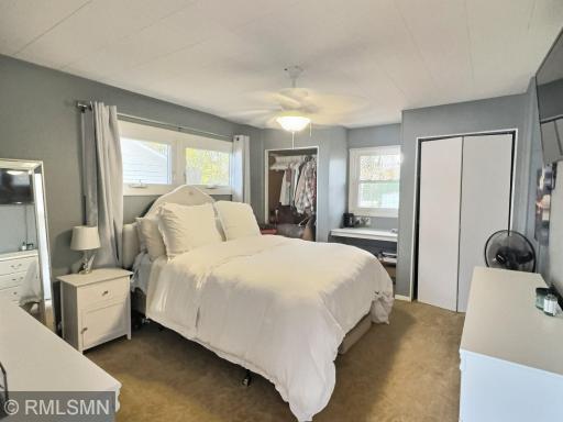 Here is the larger of the 2 bedrooms in the lake cottage with dual closets.