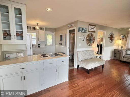 The open-concept kitchen, dining, and living areas flow effortlessly to the deck and patio, making entertaining a breeze.