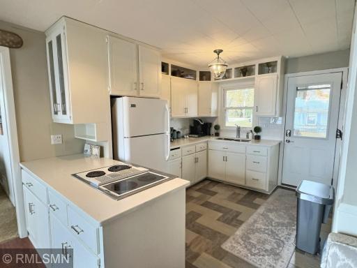 Kitchen is ideal for entertaining at the lake with easy access to both the front deck and rear patio. Kitchen has plenty of cabinets for your stay at the lake.