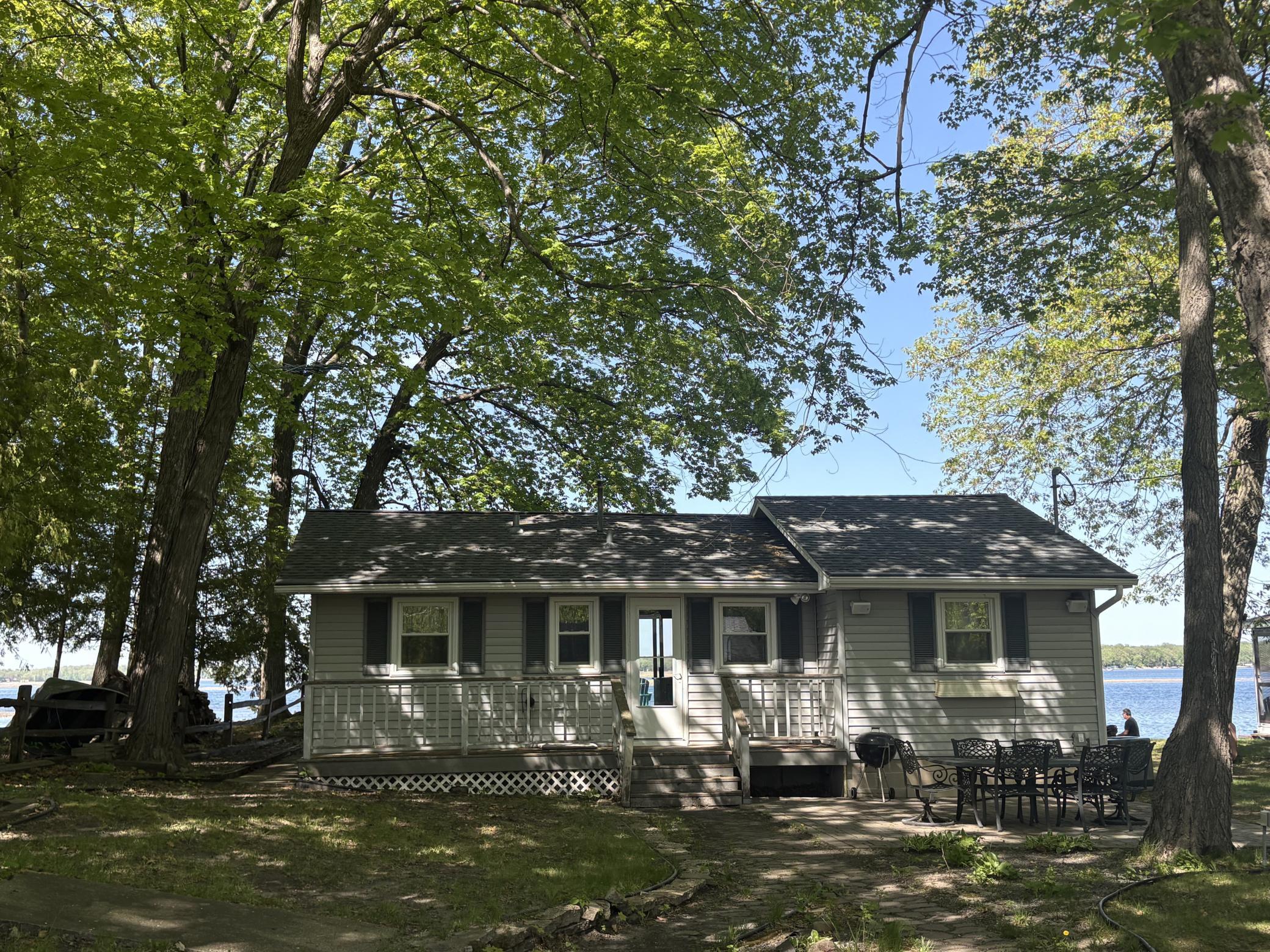 Here is the walk up to your lake place, mature trees line the lot with 50 feet of level shoreline.