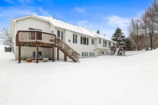 This home has a back porch and spacious backyard
