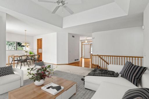 Entryway walks into open living room and dining room