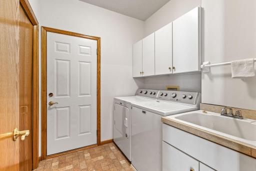 Main floor mudroom and laundry room off of the attached 2-car garage