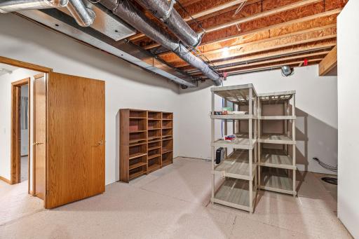 Lower level has a huge partially finished storage room with tons of potential for your needs