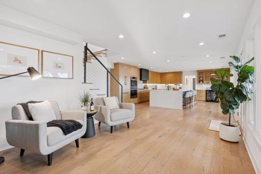 Warm natural wood floors ground the design in calm.