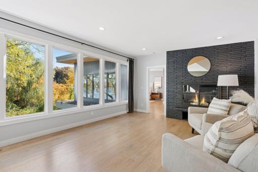 Cozy seating by the fireplace creates an inviting retreat for reading or reflection.
