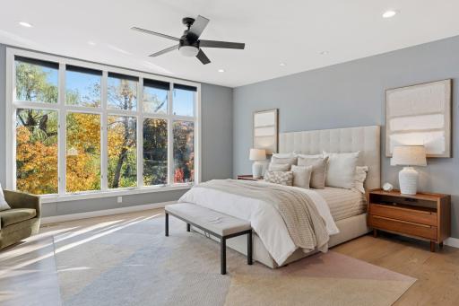 The primary suite offers inspiring lake views that bring calm to every morning.