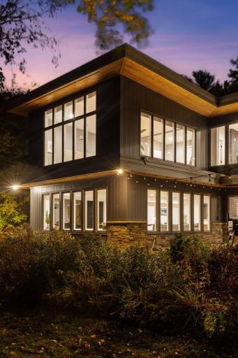 Floor-to-ceiling windows connect indoors and out.