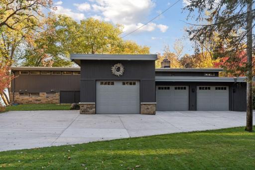 A three-car garage with EV charging awaits.