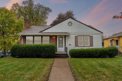 Welcome to 944 California Ave W, this Como charmer glows with warmth, highlighting its cozy character.