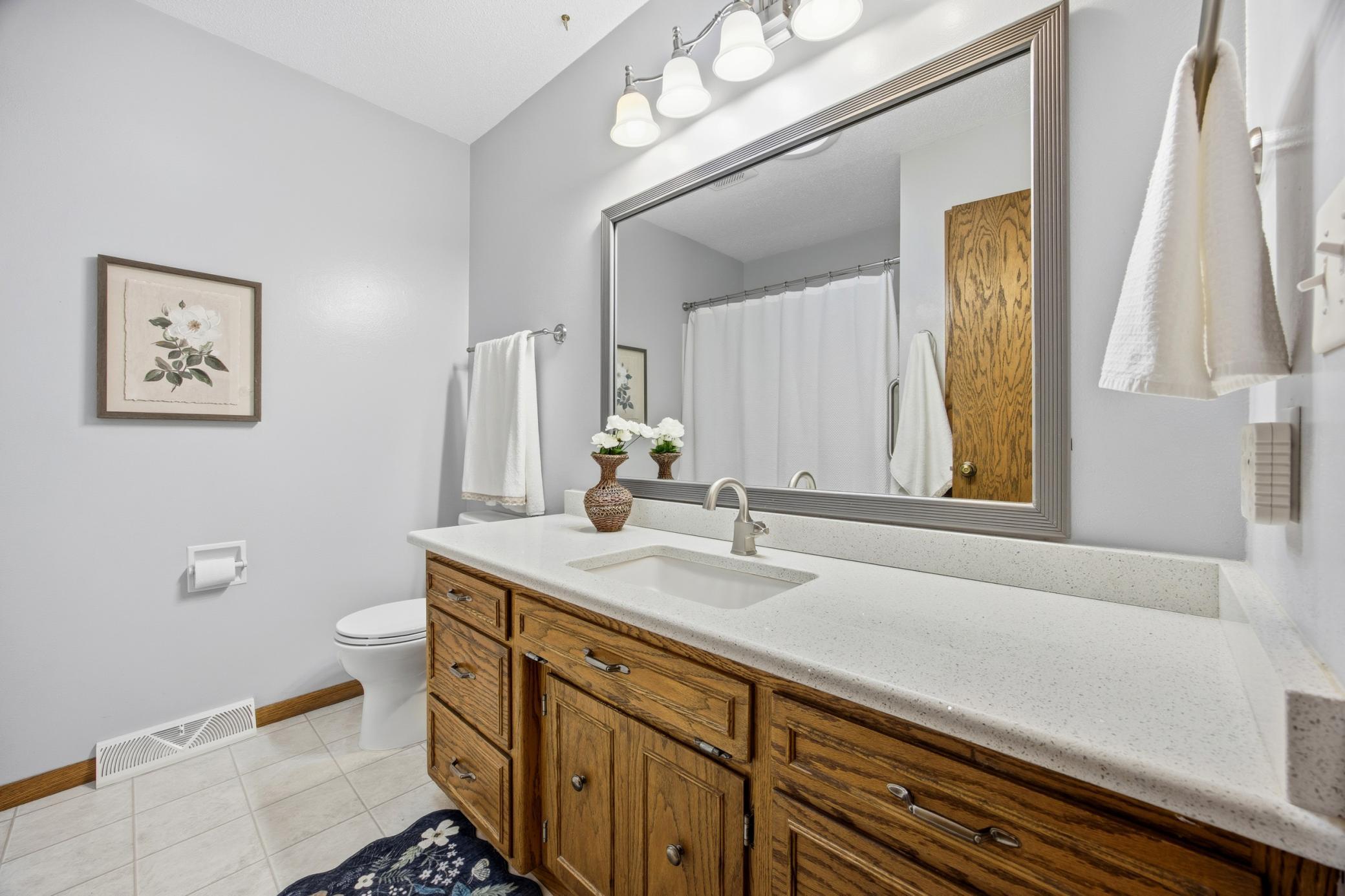 Full bath on main with quartz tops