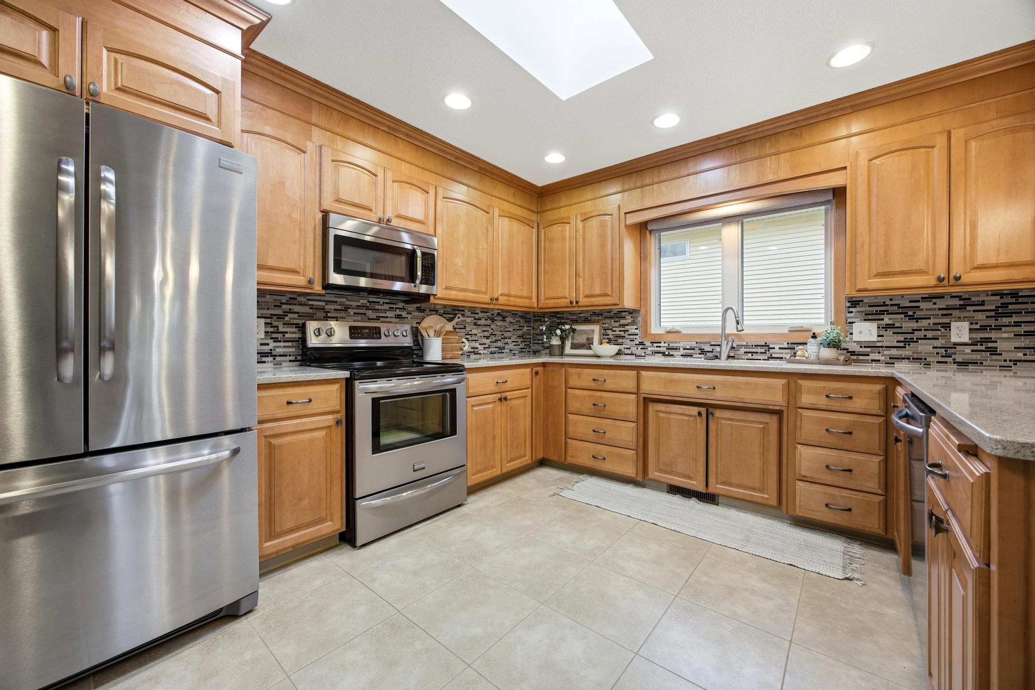 Updated kitchen cabinets and stainless steel appliances