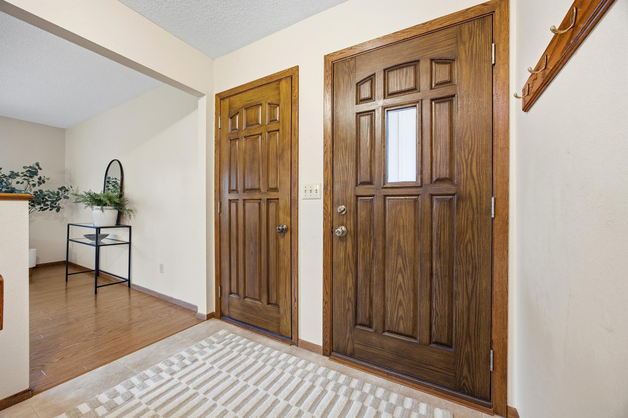 Front entryway with door to garage on left