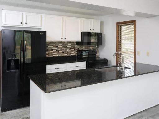 Photo for 23622 Smithtown Road, Excelsior, MN 55331 - listing #6807504 Updated kitchen with granite countertops, newer appliances, tiled backsplash and pantry.