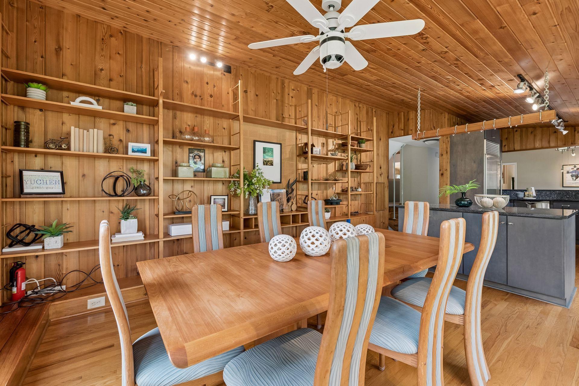 Original mid-century character has been thoughtfully preserved, from the custom wood detailing and built-ins