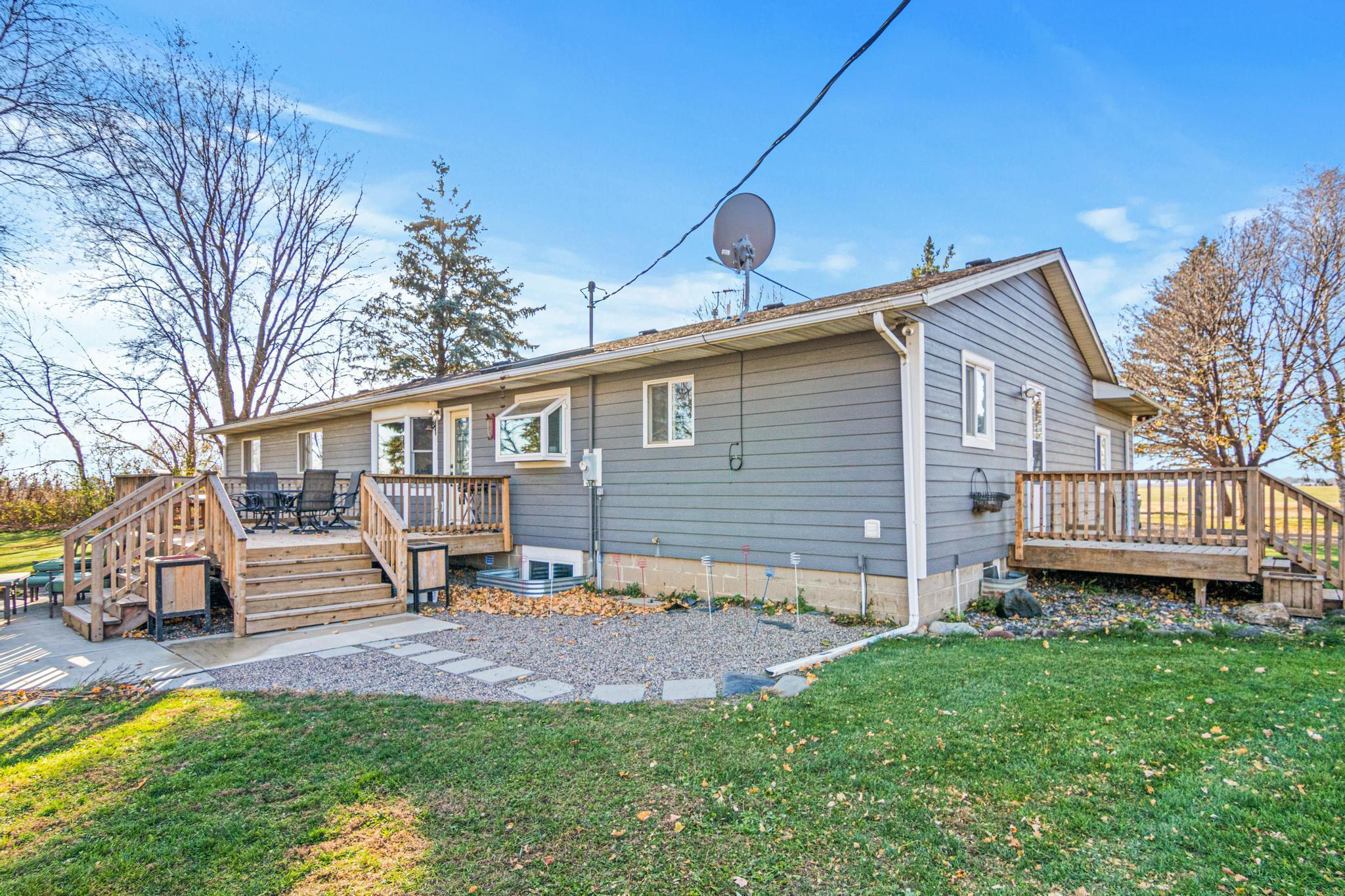 Back deck and patio area are ready for outdoor meals and relaxing evenings.