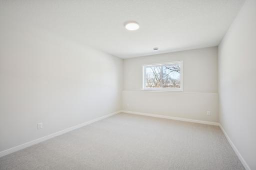 You will Love this Finished Lower Level! includes, spacious Family room, game area, and another bedroom, bathroom and large storage room!