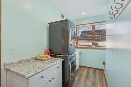 The laundry is conveniently located right off the kitchen.