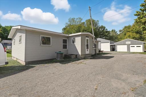 View of the home/office on the property with close proximity to the garage and pole shed.