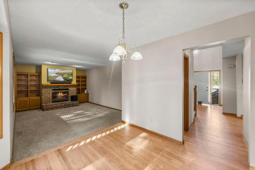 Main level family room with a cozy fireplace on those snowy winter days or crisp autumn nights.