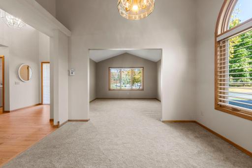 View from the vaulted formal dining room towards the formal living room and foyer.