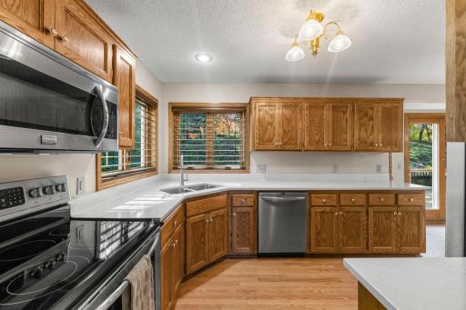 Corner sink with views of back and side yards with upgraded clear view shades!
