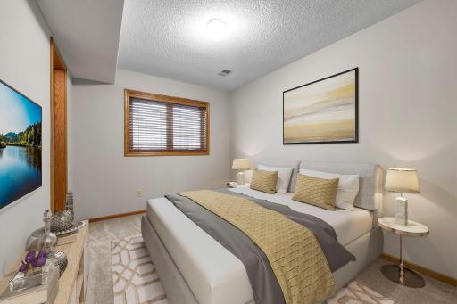 Private 5th bedroom - lower level that is great for visiting family and friends or a teenagers paradise!