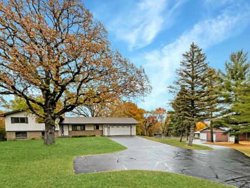 Photo for 17855 Round Lake Boulevard NW, Andover, MN 55304 - listing #6808238 Black top drive with turnaround and extended driveway down the pole buildings and rear garage