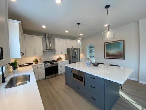 New Home Now finished! 5 bedrooms & 3-car garage. Quick Move in Available: Enjoy cooking & entertaining in this beautiful super-sized kitchen! and Custom Cabinets!