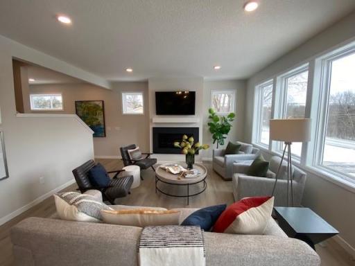 Large Gathering room with wall of windows, and gas fireplace!