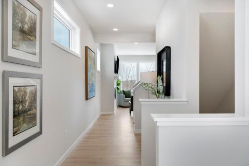 Main floor entrance with abundance of windows! and beautiful turned staircase to 2nd floor 4 bedrooms and loft; or to finished lower level with family room 5th bedroom and bath.