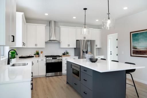 New Home Now finished! 5 bedrooms & 3-car garage. Quick Move in Available: Enjoy cooking & entertaining in this beautiful super-sized kitchen! Custom Cabinets!