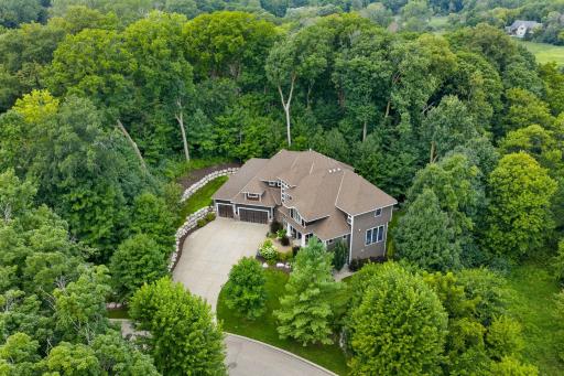 Serene 1.5 acre lot of wooded privacy located on a cul-de-sac! Home boasts a main level sport court, entertaining dream lower level and fenced yard! Located on a private 1.5 acre wooded lot in serene Woolman Woods Neighborhood.