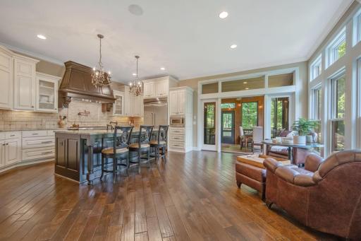 Gourmet Kitchen with upgraded appliances, gorgeous countertops, and custom cabinetry! You will love this space, and the views to the wooded backyard from your center island!