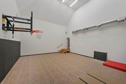 Incredible Sport court located right off the main level for easy access and supervision of all the fun this space will bring!