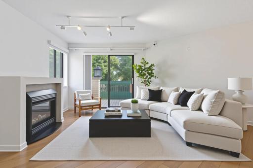 Virtually staged living room -walks out to deck