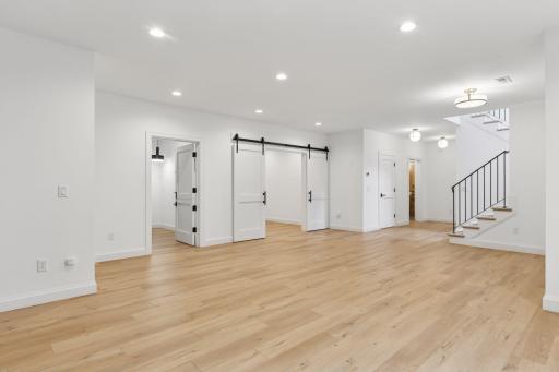 Lower level has work out room with double barn doors and laundry with pet wash