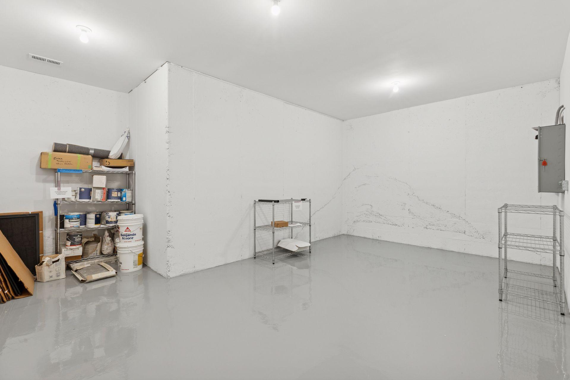 Finished floors in the lower level storage area. Could be finished to add more livable space if needed