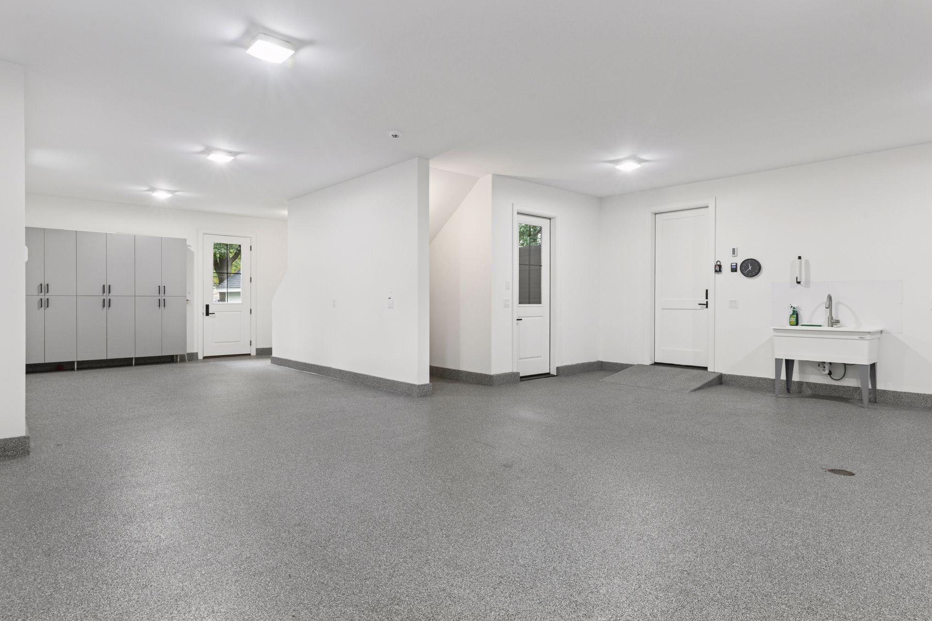 Garage has great storage and full sink