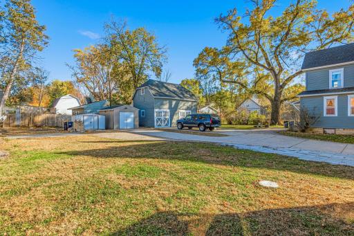 Blue barn/shed does NOT belong to property. Left hand side of driveway, plus two sheds on left belong to 405 Washington. There is room to park multiple vehicles.