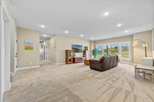Walk-out patio door leads to a HUGE concrete patio set up for hot tub