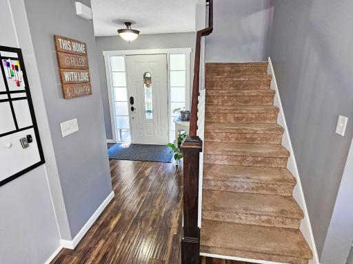 Entry and stairs to the upper level from the kitchen/informal eating area.