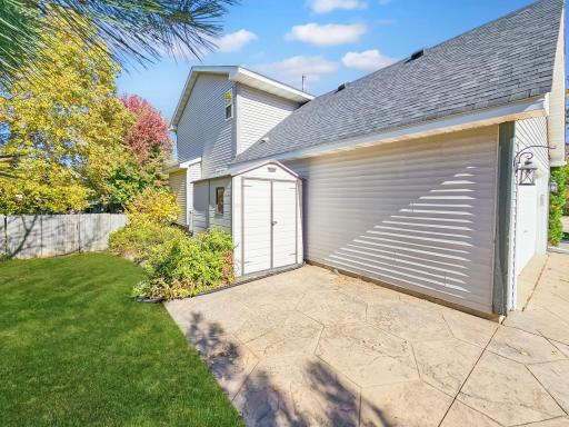 extra parking on the side of the garage with more storage.